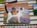 Painting of a mouse riding on a cat